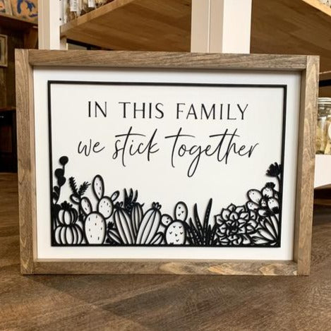 In this Family We Stick Together Framed Sign